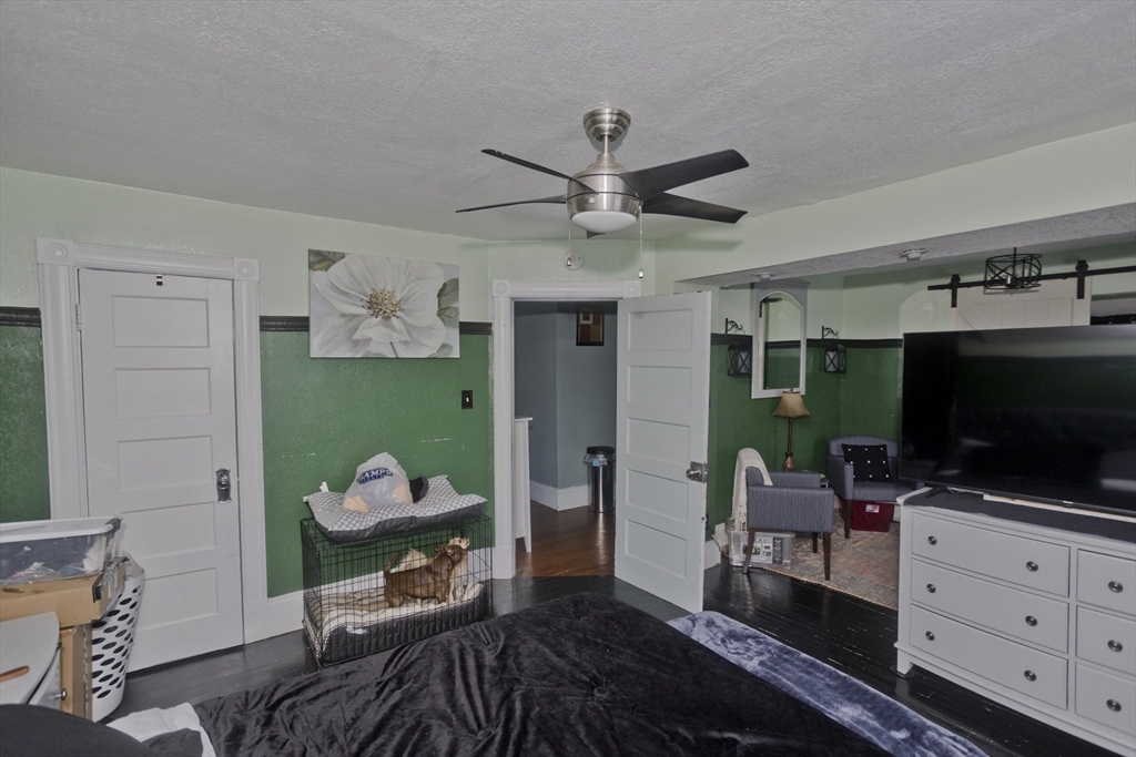 41 Embury Street Springfield, MA 01109 - Photo 17 of 41 a living room with furniture and a flat screen tv