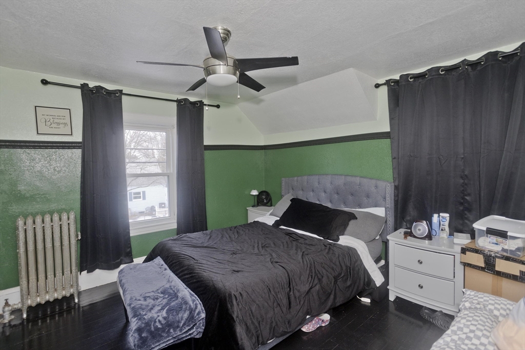 41 Embury Street Springfield, MA 01109 - Photo 19 of 41 a bedroom with a bed window and cabinet