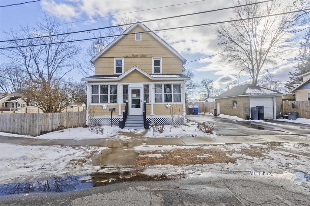 41 Embury Street Springfield, MA 01109 - Photo 2 of 41 a front view of a house with yard and covered in snow