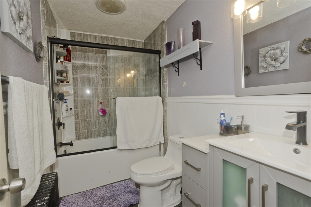 41 Embury Street Springfield, MA 01109 - Photo 21 of 41 a bathroom with a sink toilet and shower