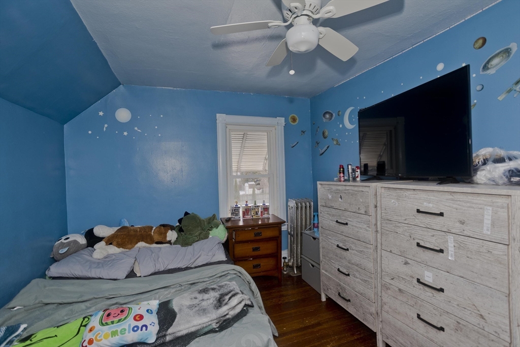 41 Embury Street Springfield, MA 01109 - Photo 22 of 41 a bedroom with a bed and flat screen tv