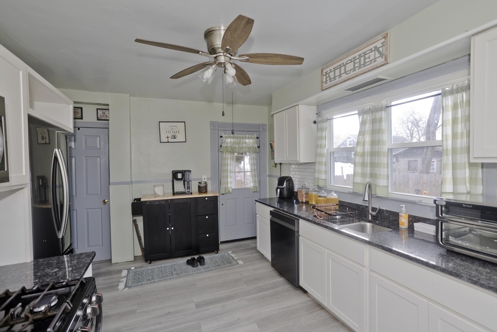 41 Embury Street Springfield, MA 01109 - Photo 28 of 41 a kitchen with stainless steel appliances a sink a stove and a refrigerator