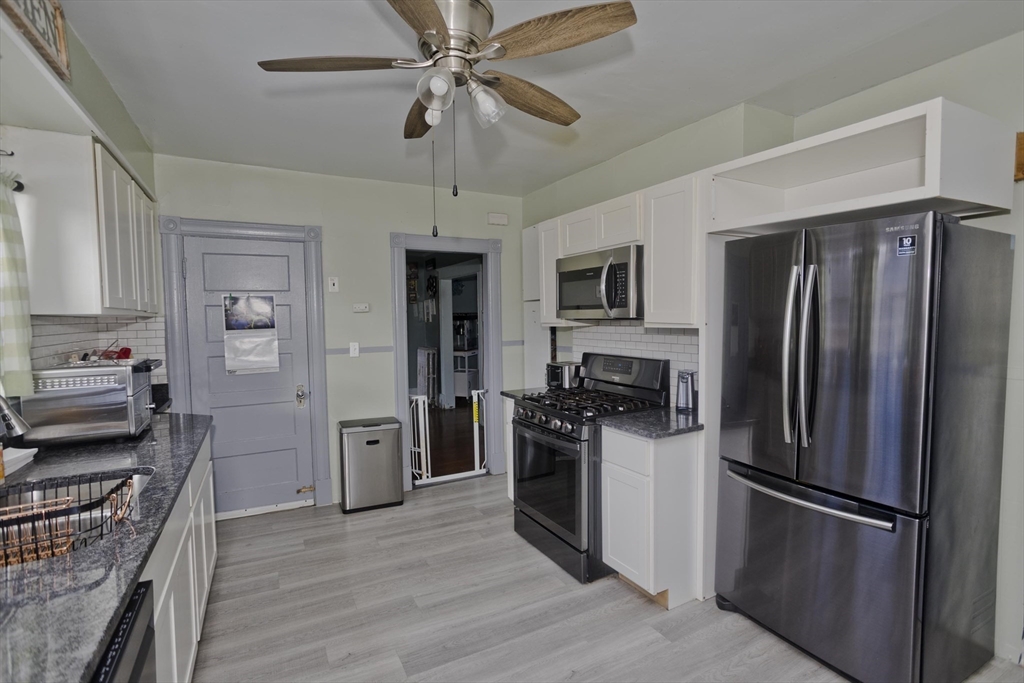 41 Embury Street Springfield, MA 01109 - Photo 30 of 41 a kitchen with stainless steel appliances a refrigerator stove and microwave