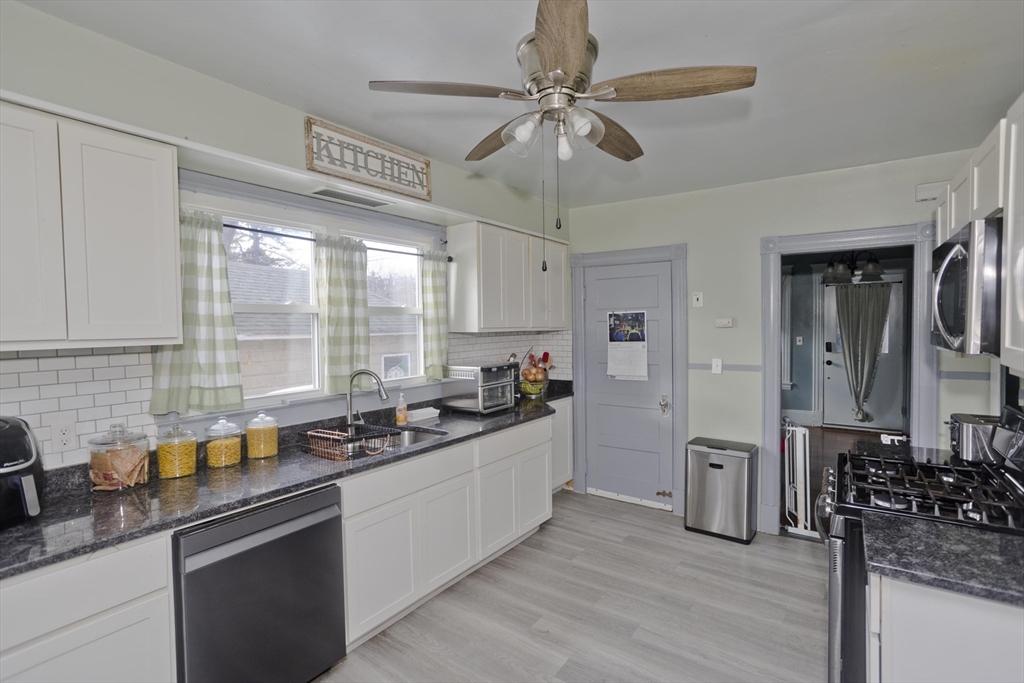 41 Embury Street Springfield, MA 01109 - Photo 32 of 41 a kitchen with stainless steel appliances a sink stove and refrigerator