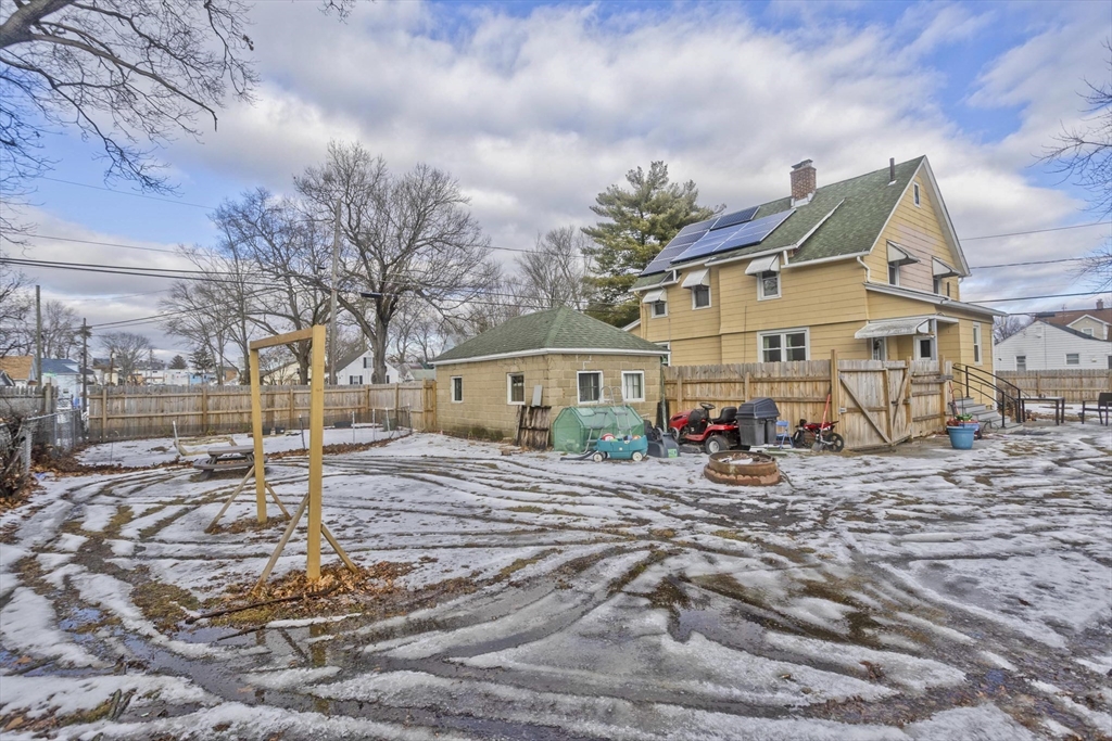 41 Embury Street Springfield, MA 01109 - Photo 5 of 41 a view of a white house next to a road and yard