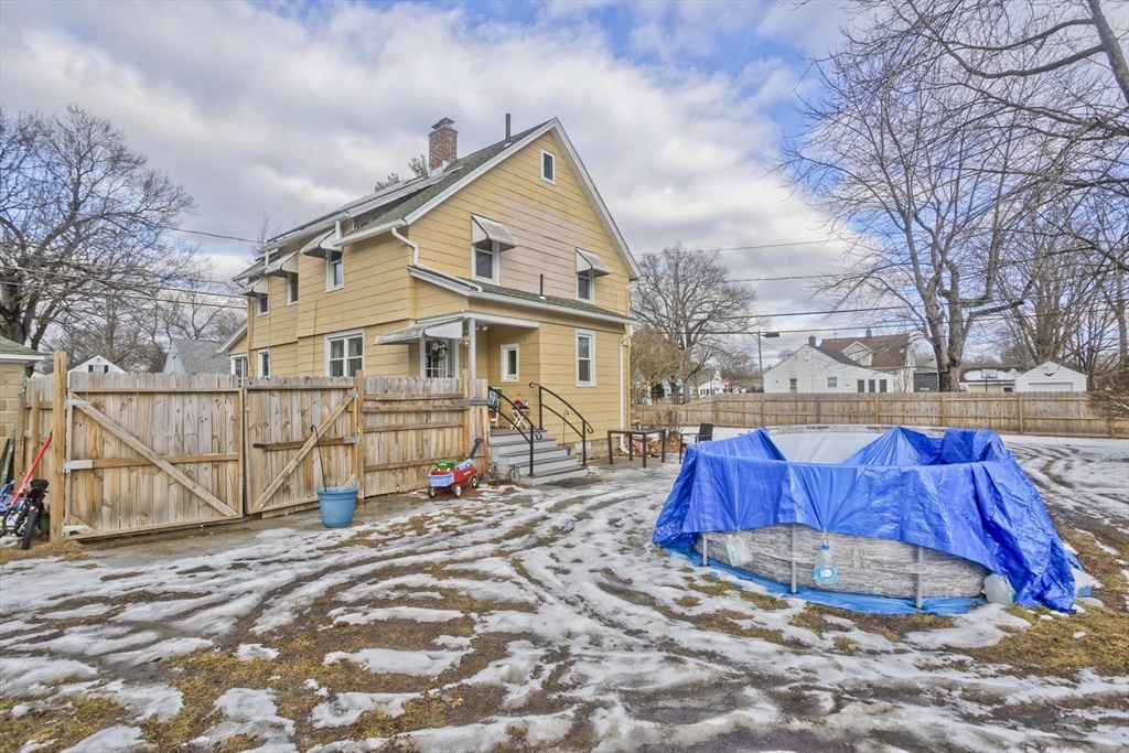 41 Embury Street Springfield, MA 01109 - Photo 6 of 41 a view of a house with wooden fence