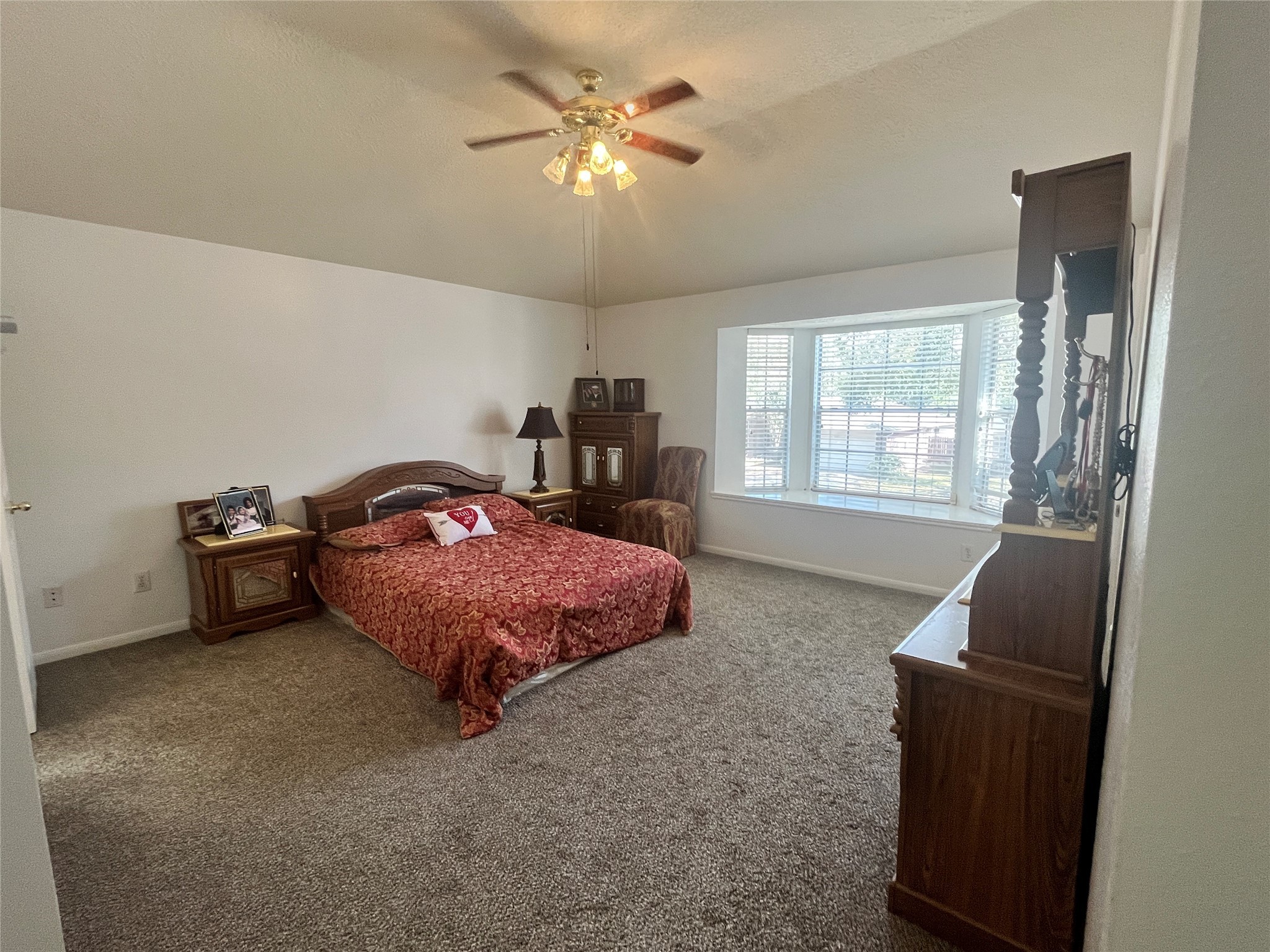 28723 Sedgefield Street Spring, TX 77386 - Photo 13 of 27 a spacious bedroom with a bed and a couch