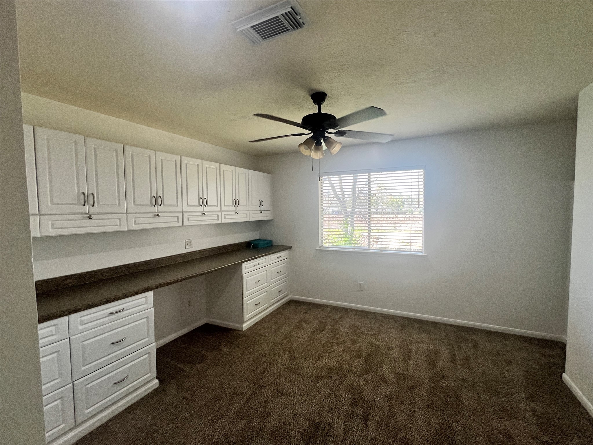 28723 Sedgefield Street Spring, TX 77386 - Photo 17 of 27 a kitchen with granite countertop a sink cabinets stainless steel appliances and a window