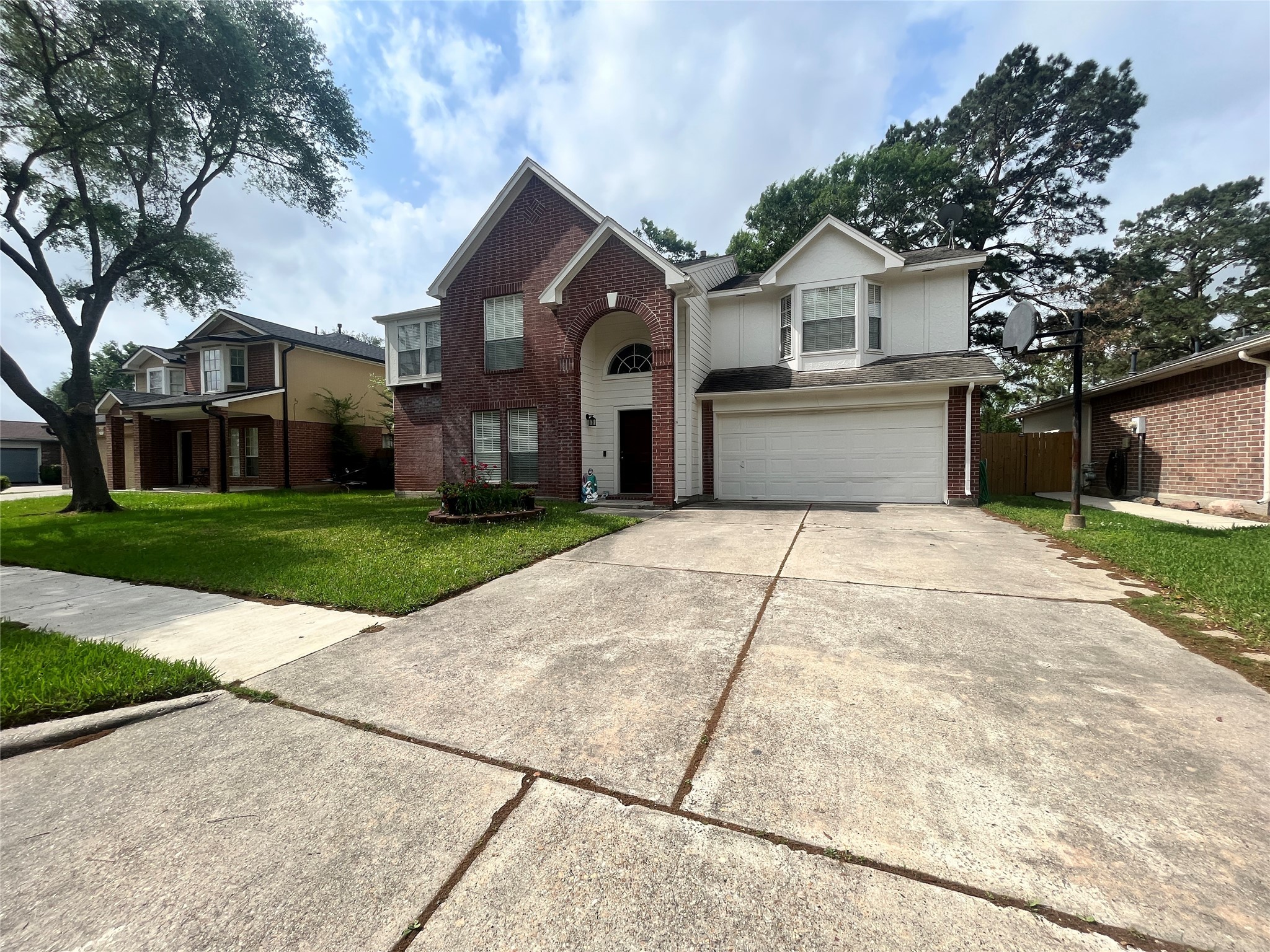 28723 Sedgefield Street Spring, TX 77386 - Photo 2 of 27 a front view of a house with a yard and trees