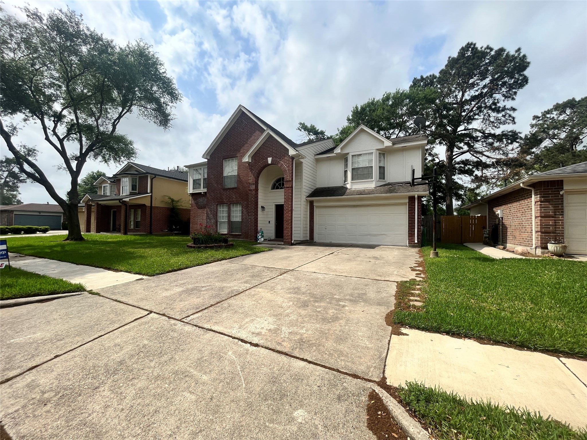 28723 Sedgefield Street Spring, TX 77386 - Photo 3 of 27 a front view of a house with a yard and garage