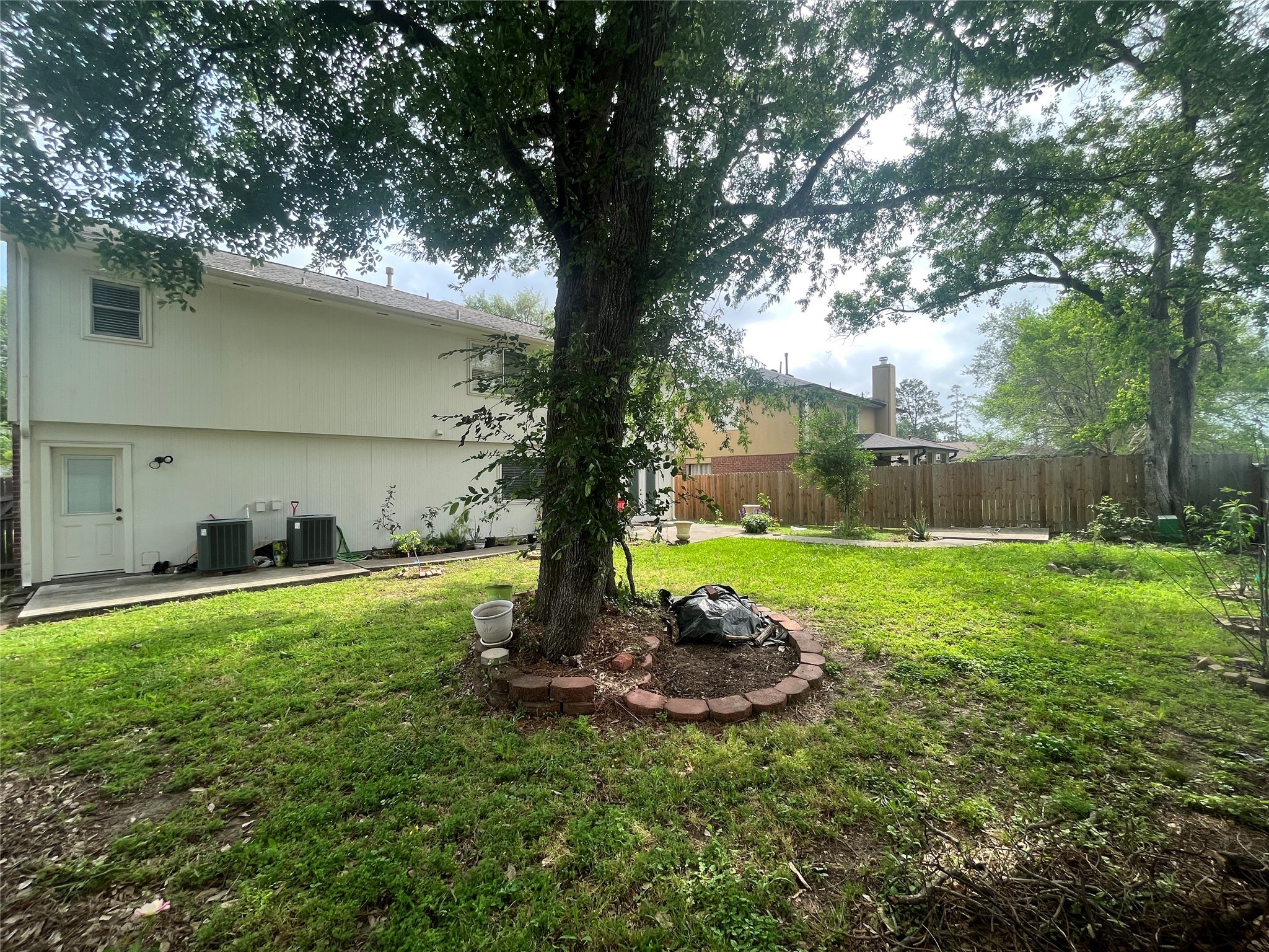 28723 Sedgefield Street Spring, TX 77386 - Photo 6 of 27 a view of a backyard with a tree