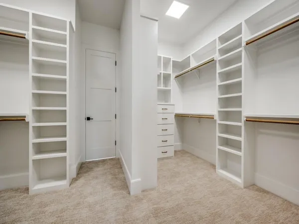 a view of an empty walk in closet