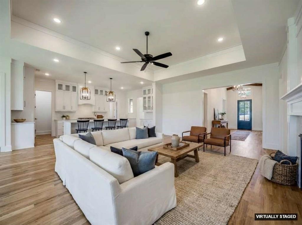 301 Fairmount Court Denton, TX 76210 - Photo 24 of 28 a living room with furniture and wooden floor