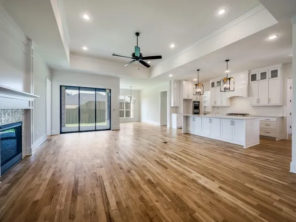 a view of kitchen with cabinets and wooden floor
