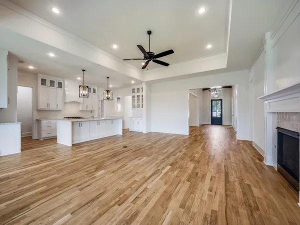 a view of kitchen with cabinets and wooden floor