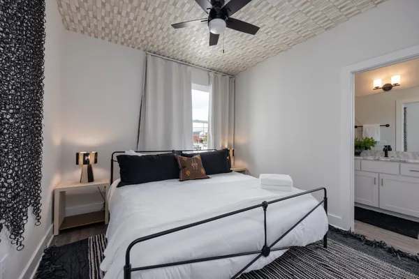 a bedroom with a bed and a dresser