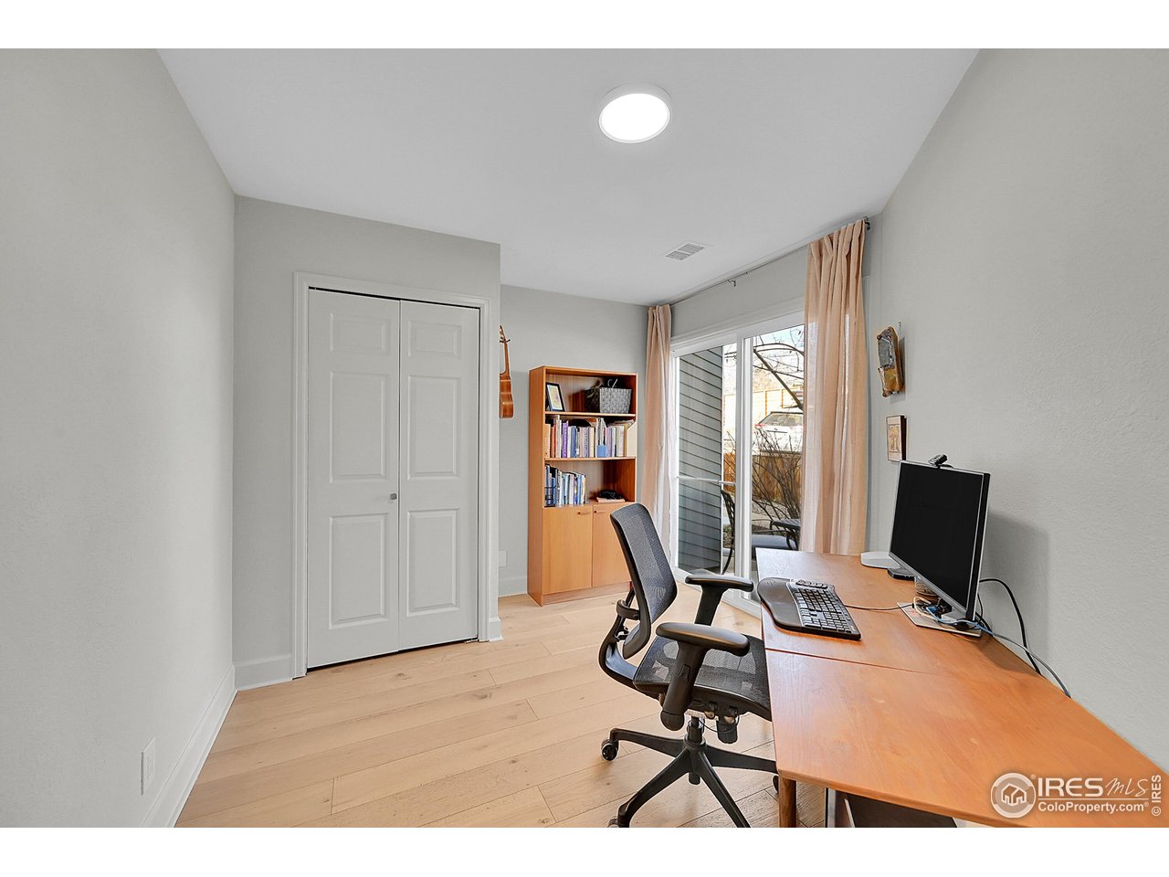 1749 Alpine Avenue, Unit 10 Boulder, CO 80304 - Photo 13 of 40 Bedroom 1 on main floor with attached patio space