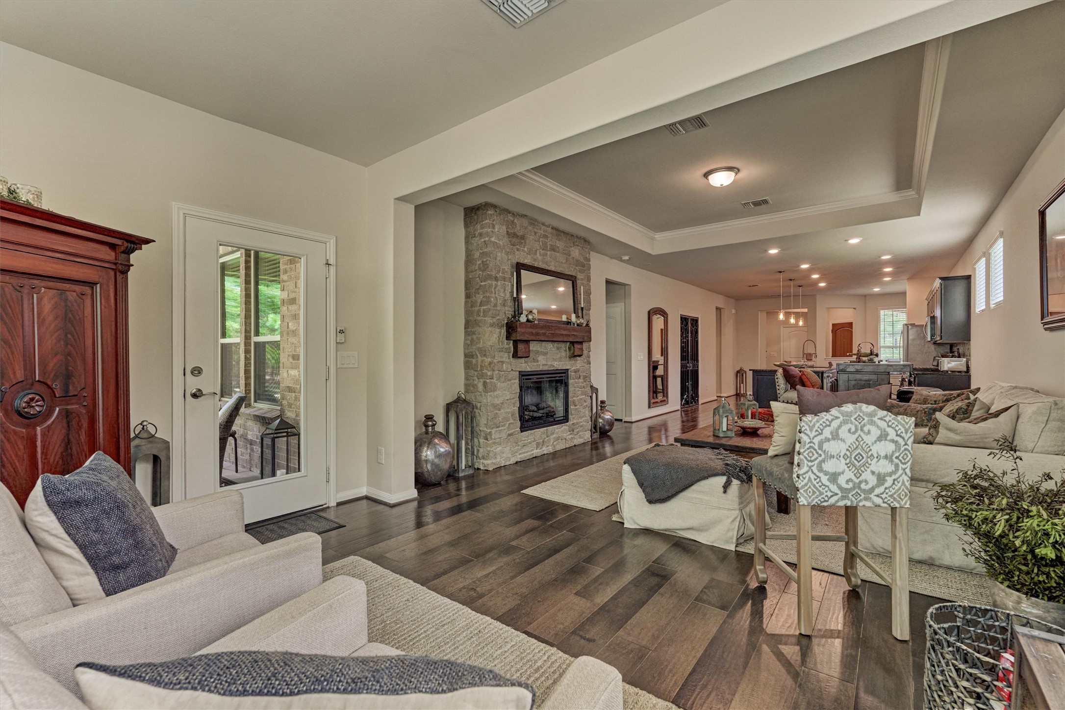 128 Caspian Way Spring Spring, TX 77382 - Photo 19 of 48 a living room with furniture and a wooden floor