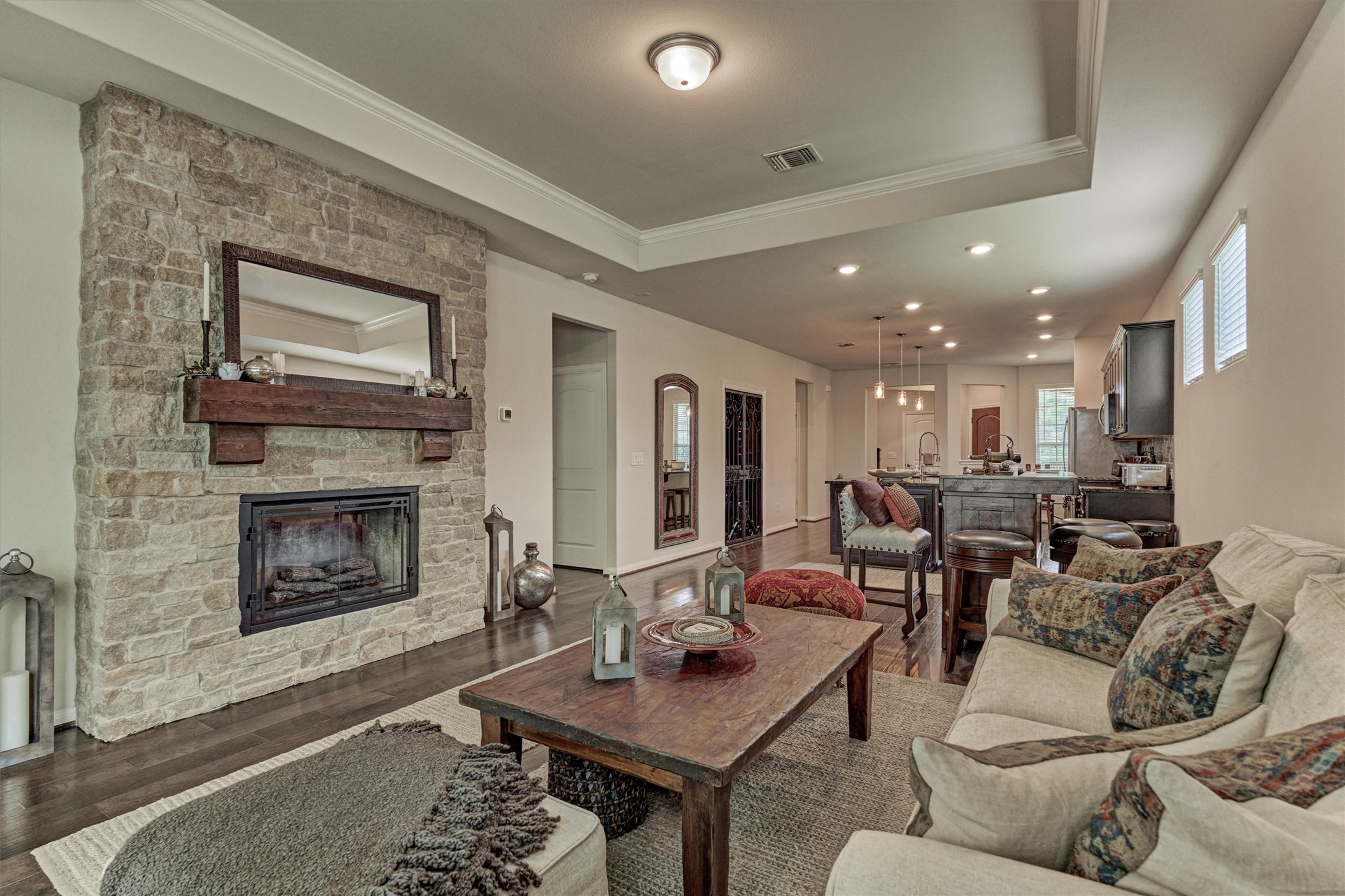 128 Caspian Way Spring Spring, TX 77382 - Photo 20 of 48 a living room with furniture a fireplace and a flat screen tv