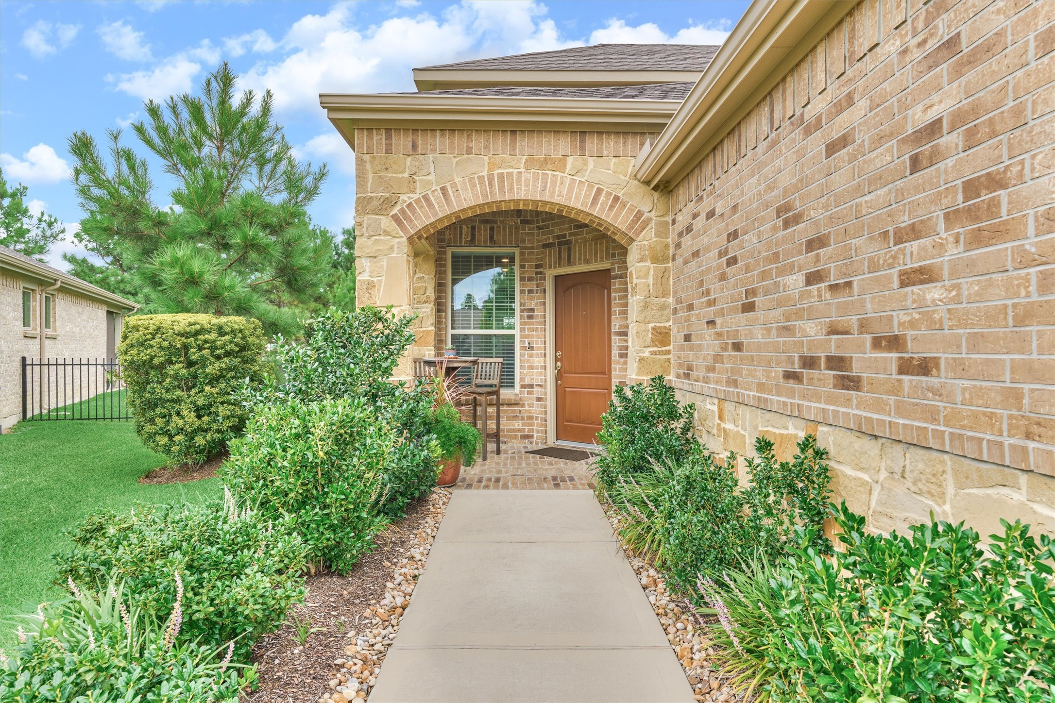 128 Caspian Way Spring Spring, TX 77382 - Photo 2 of 48 a front view of a house with garden