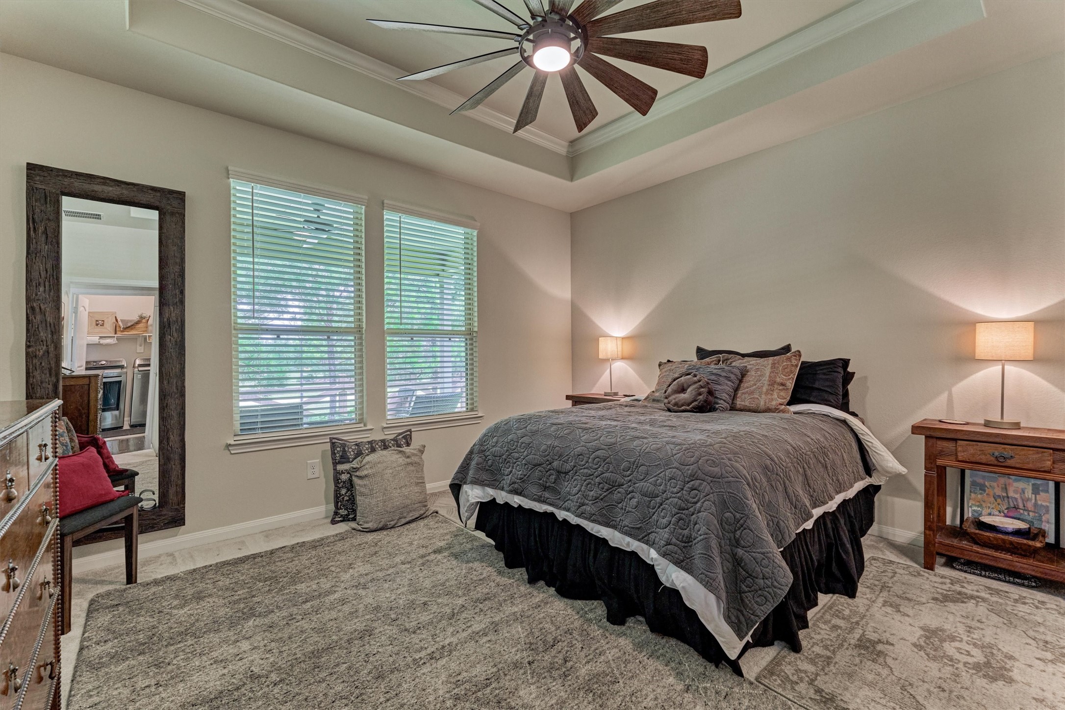 128 Caspian Way Spring Spring, TX 77382 - Photo 21 of 48 a spacious bedroom with a bed a window and a chandelier
