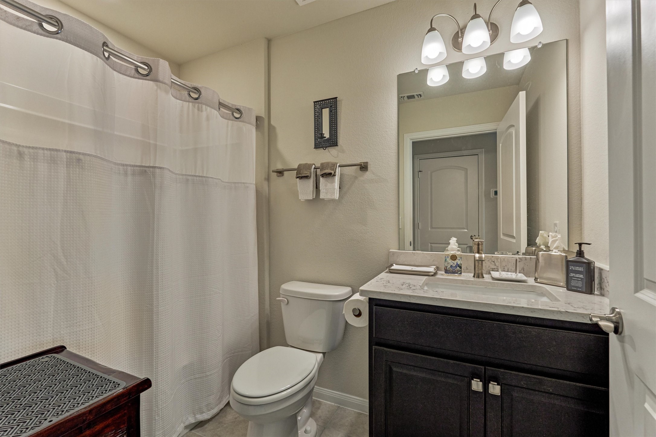 128 Caspian Way Spring Spring, TX 77382 - Photo 30 of 48 a bathroom with a sink vanity mirror and toilet