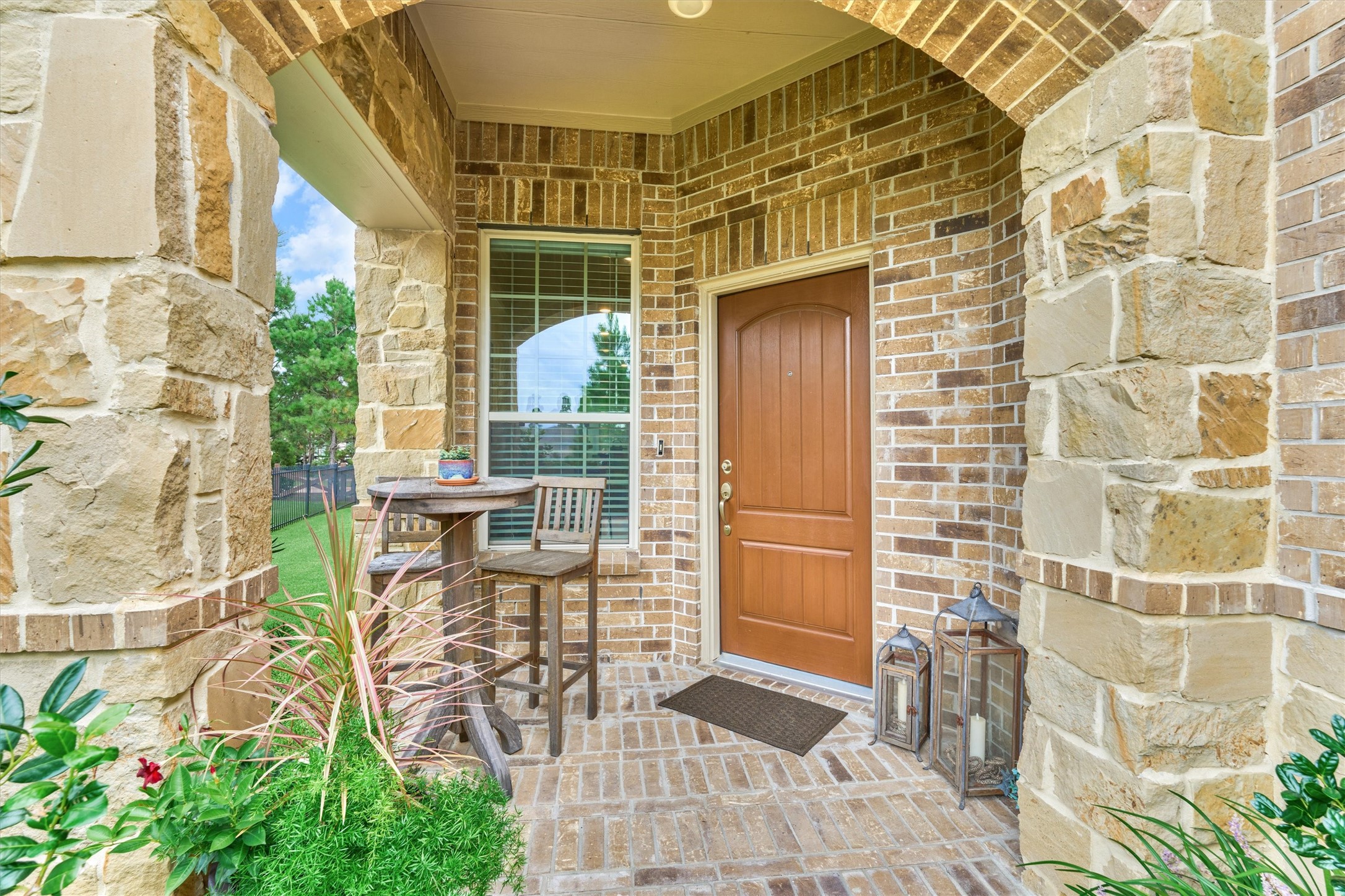 128 Caspian Way Spring Spring, TX 77382 - Photo 3 of 48 a patio with table and chairs and potted plants