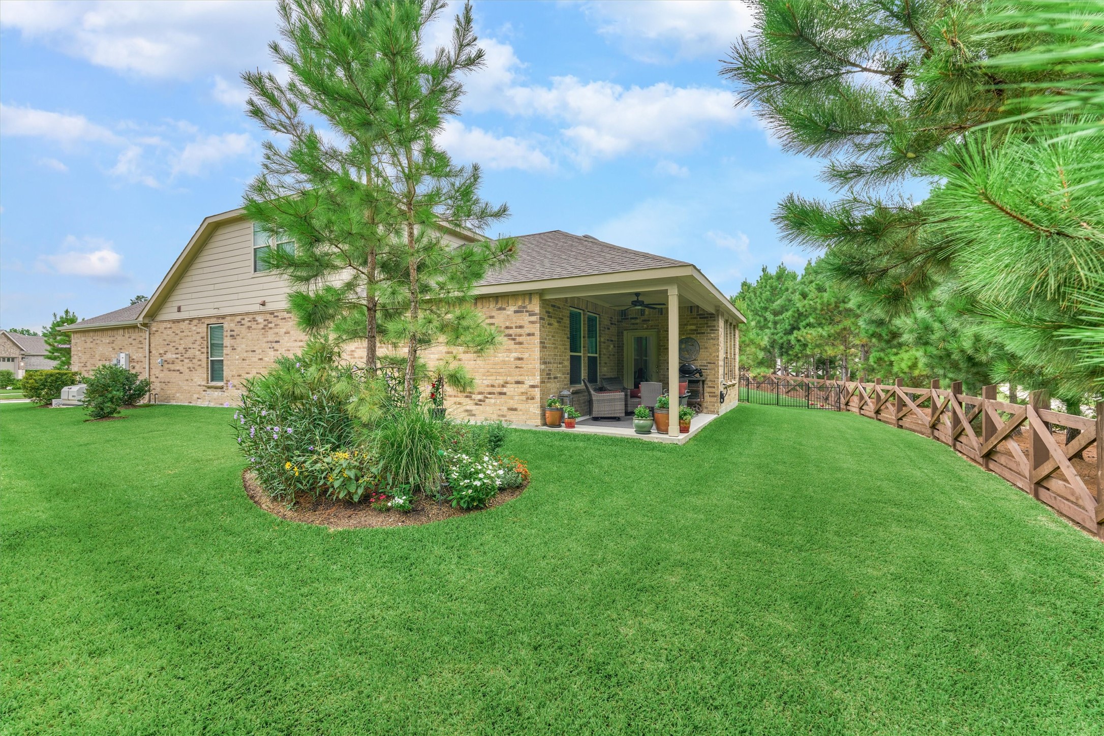 128 Caspian Way Spring Spring, TX 77382 - Photo 36 of 48 a front view of a house with a garden