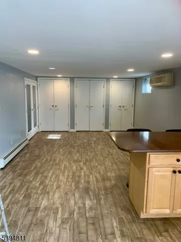 a view of a kitchen with wooden floor