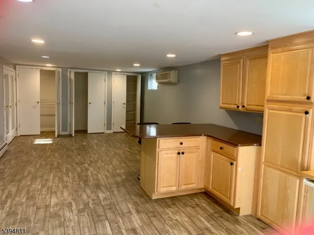 a kitchen with stainless steel appliances granite countertop a refrigerator and a stove