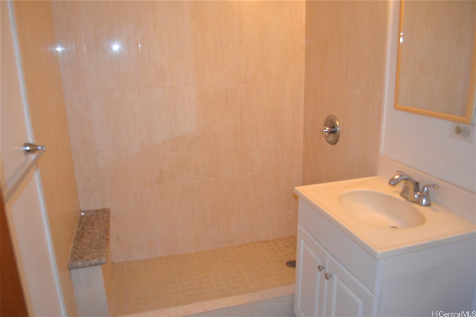 814 Kinau Street, Unit 202 Honolulu, HI 96813 - Photo 11 of 14 a bathroom with a sink and a mirror