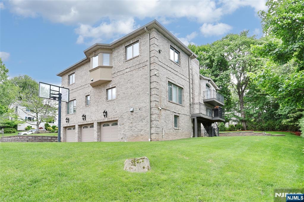 65 Ross Avenue Demarest, NJ 07627 - Photo 46 of 48 a view of a house with a yard