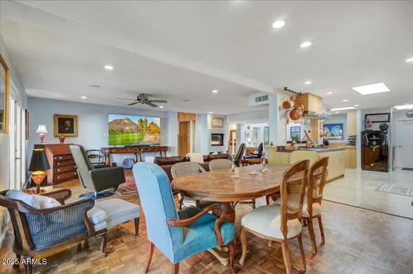 a dining room with furniture and wooden floor