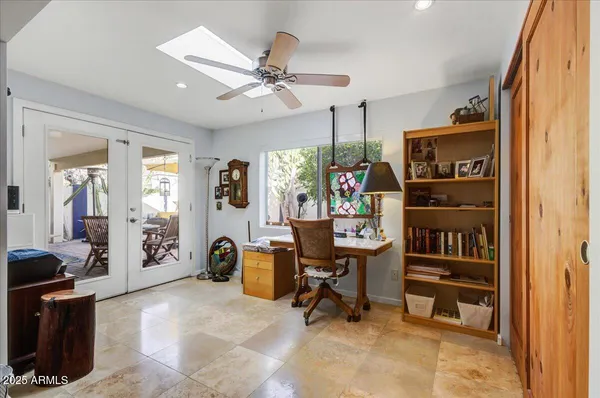 a bedroom with a bed and chair