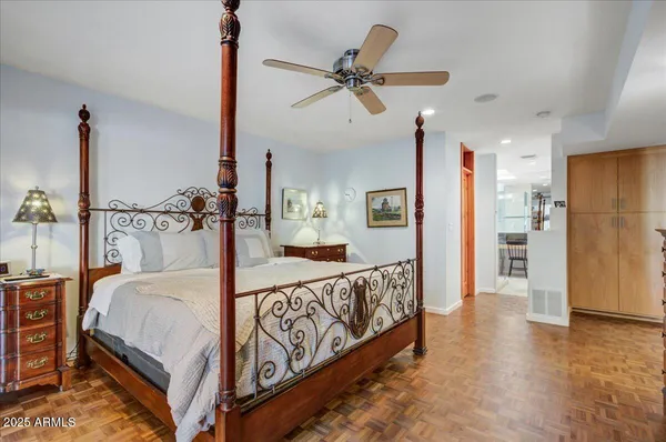a large bathroom with a granite countertop sink a mirror and a shower