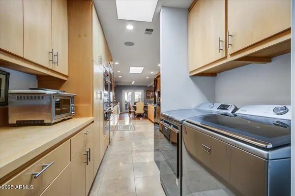 a view of a patio with chairs and tables