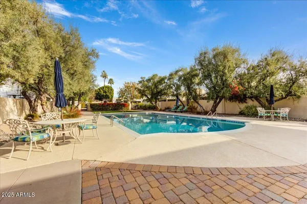 a living room with furniture rug and a table