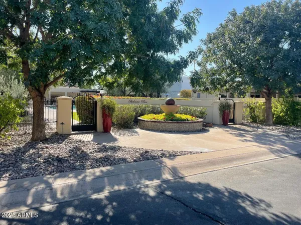 a front view of a house with outdoor seating