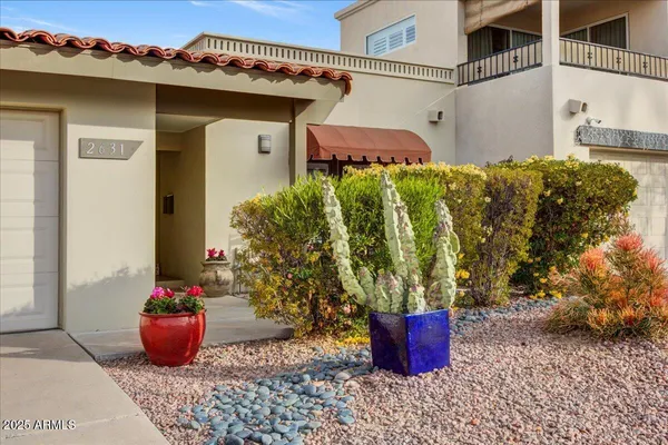 a view of a porch with potted plants