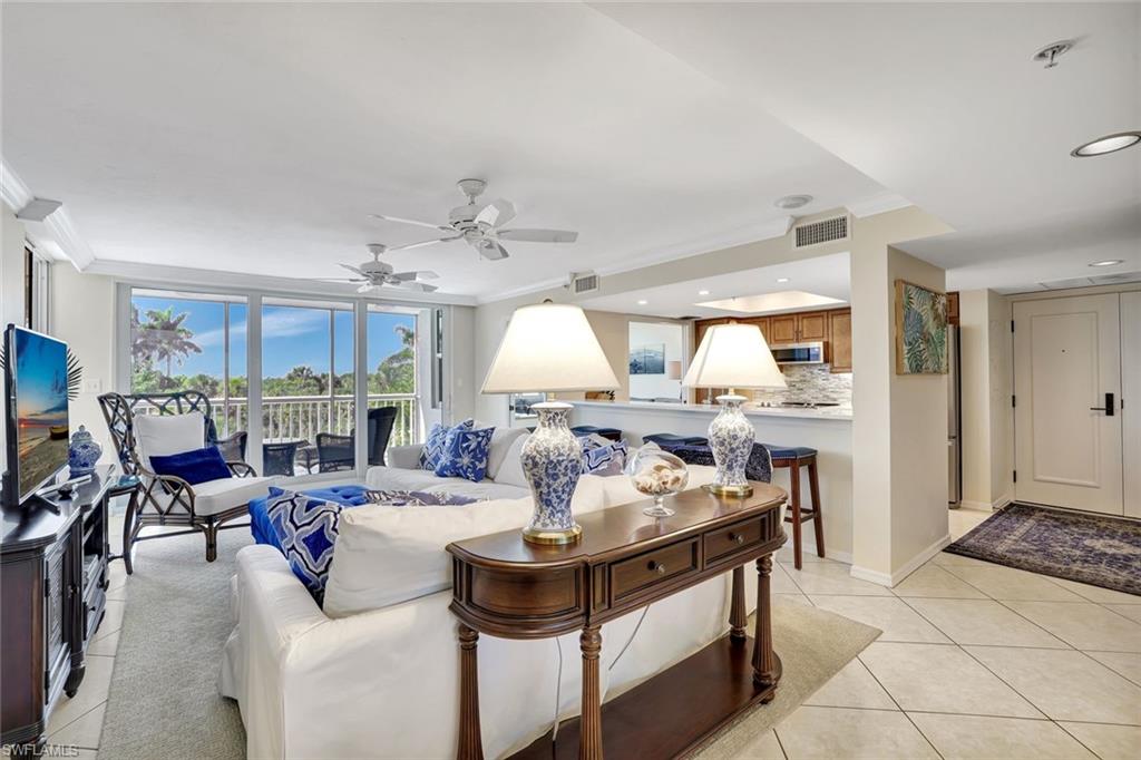 6573 Marissa Loop, Unit 302 Naples, FL 34108 - Photo 5 of 23 Living room featuring ornamental molding, light tile patterned floors, a ceiling fan, and recessed lighting