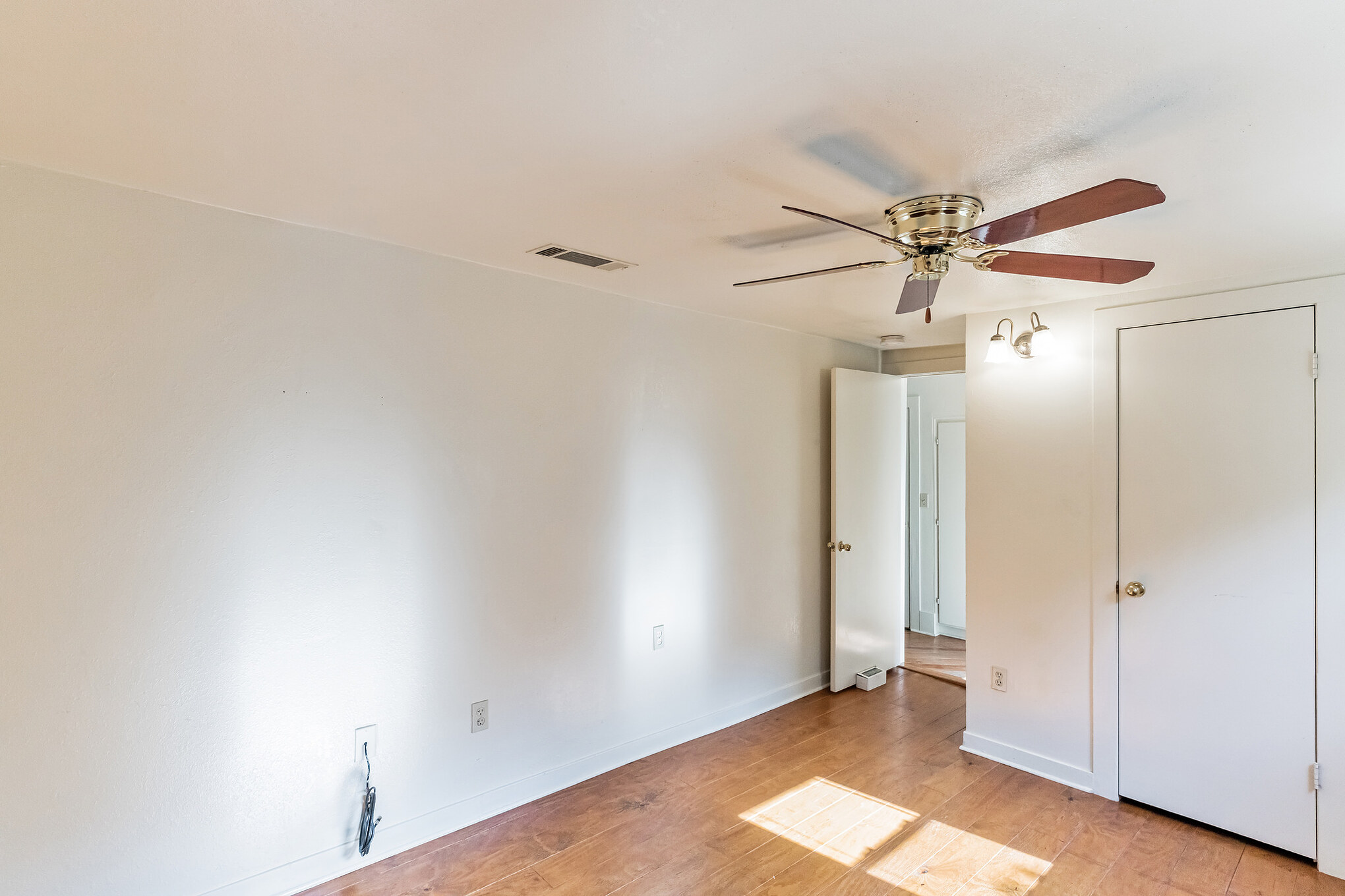 501 East 4th Street Georgetown, TX 78626 - Photo 15 of 25 Unfurnished bedroom with light wood finished floors and ceiling fan