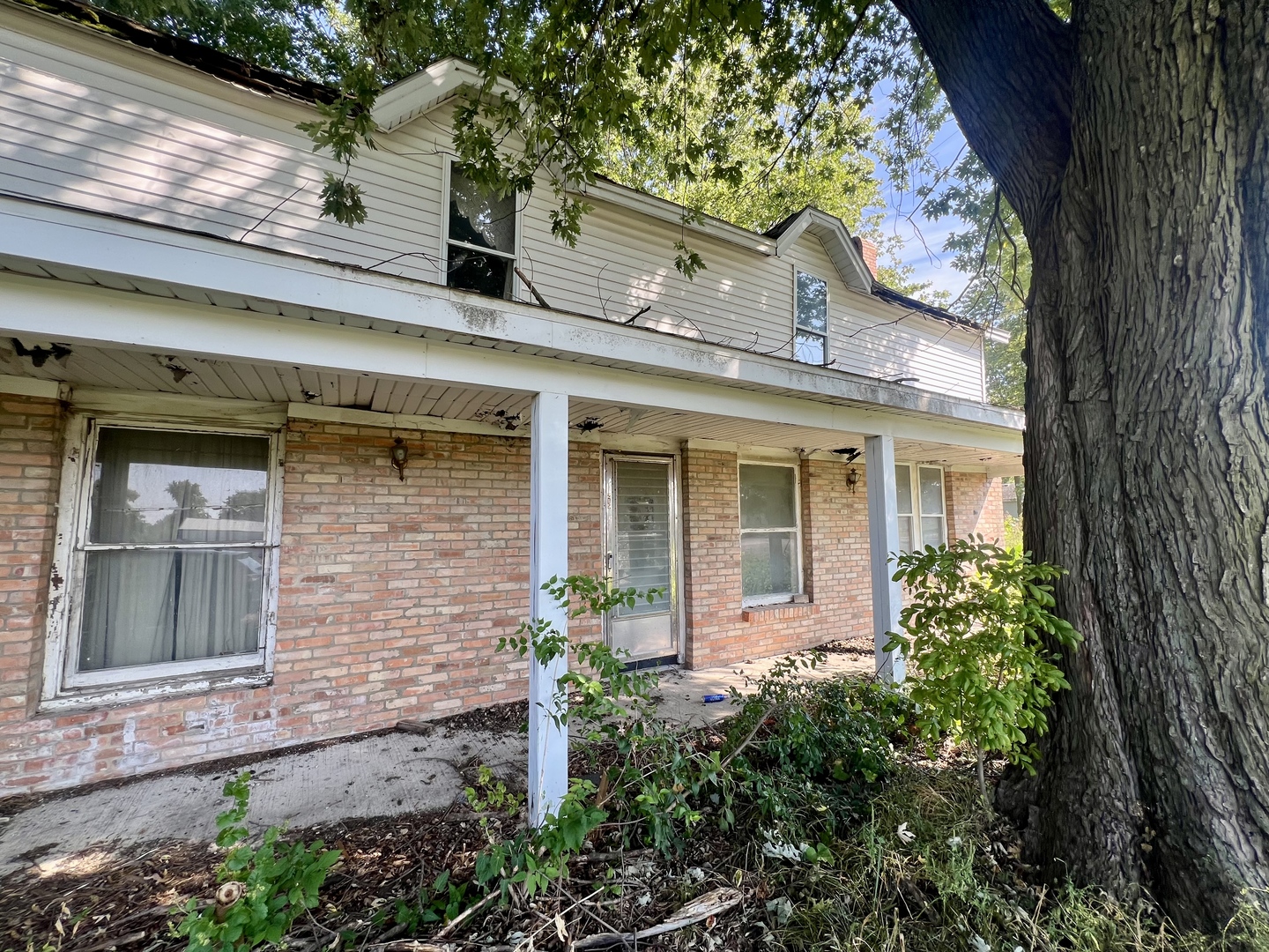 215 West Main Street Sheldon, IL 60966 - Photo 4 of 4 front view of a brick house with a large window