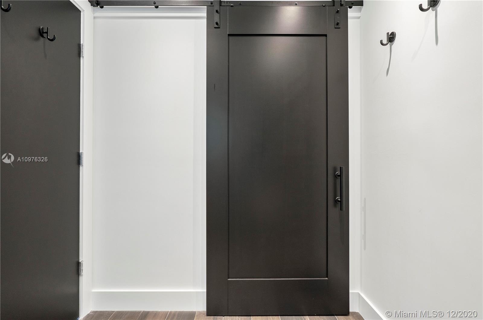 8101 Biscayne Boulevard, Unit R602 Miami, FL 33138 - Photo 16 of 25 Bathroom Barn Door. Spacious laundry behind doors.