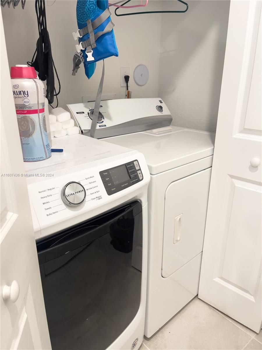 13414 Southwest 286th Street, Unit 13414 Homestead, FL 33033 - Photo 13 of 34 a utility room with dryer and washer