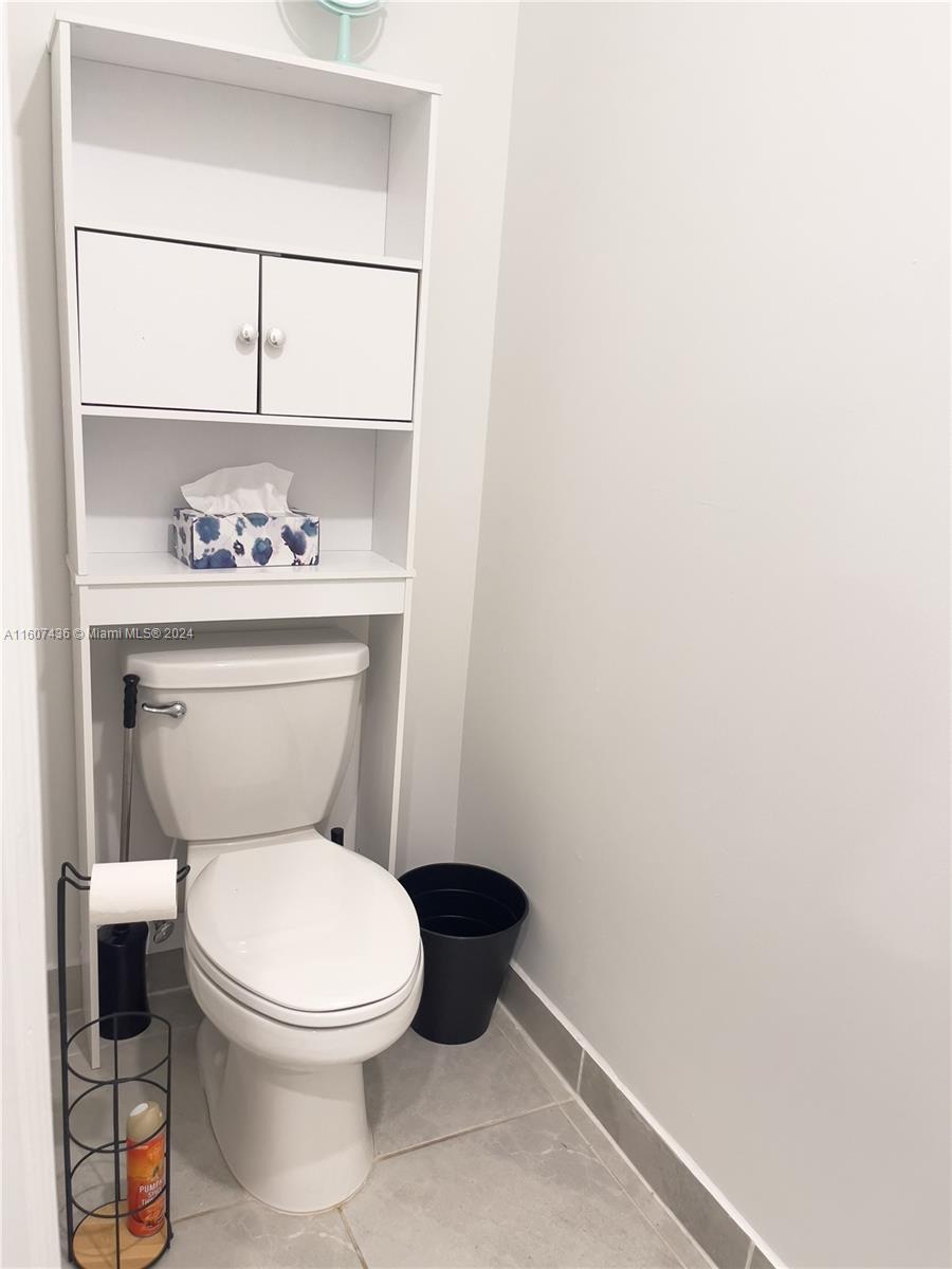 13414 Southwest 286th Street, Unit 13414 Homestead, FL 33033 - Photo 14 of 34 a bathroom with a toilet