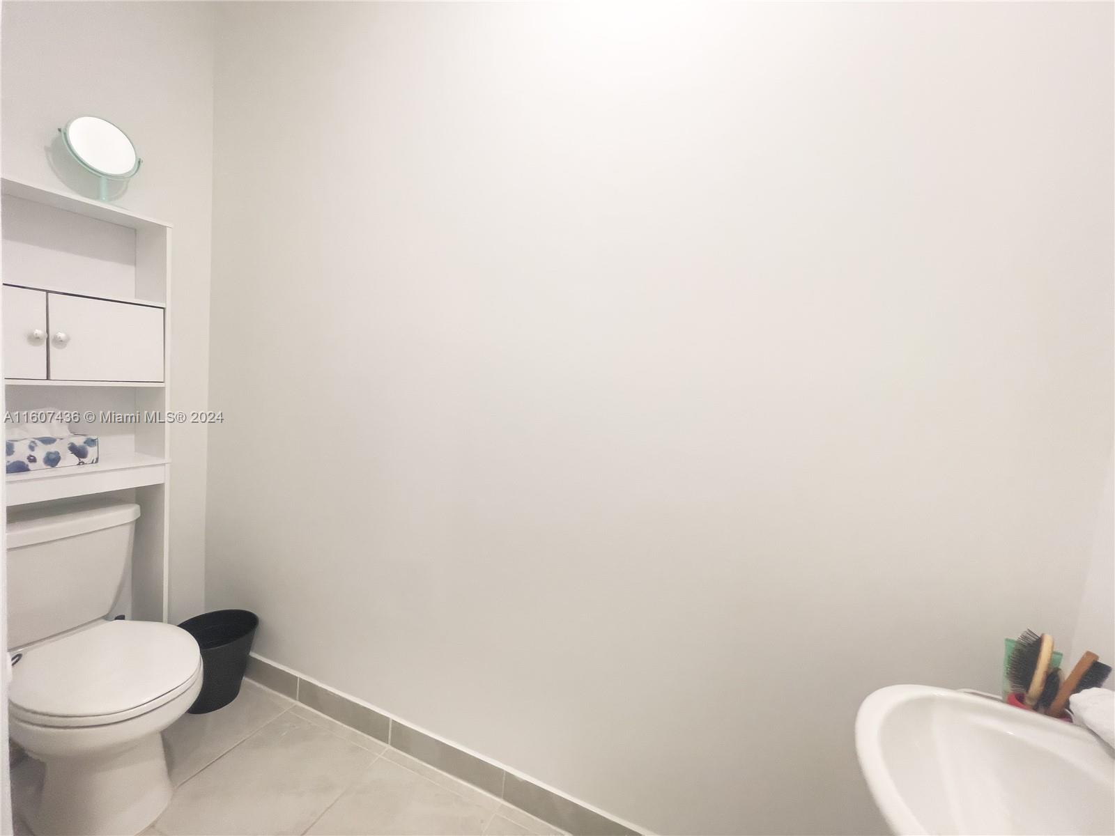 13414 Southwest 286th Street, Unit 13414 Homestead, FL 33033 - Photo 16 of 34 a bathroom with a toilet and sink