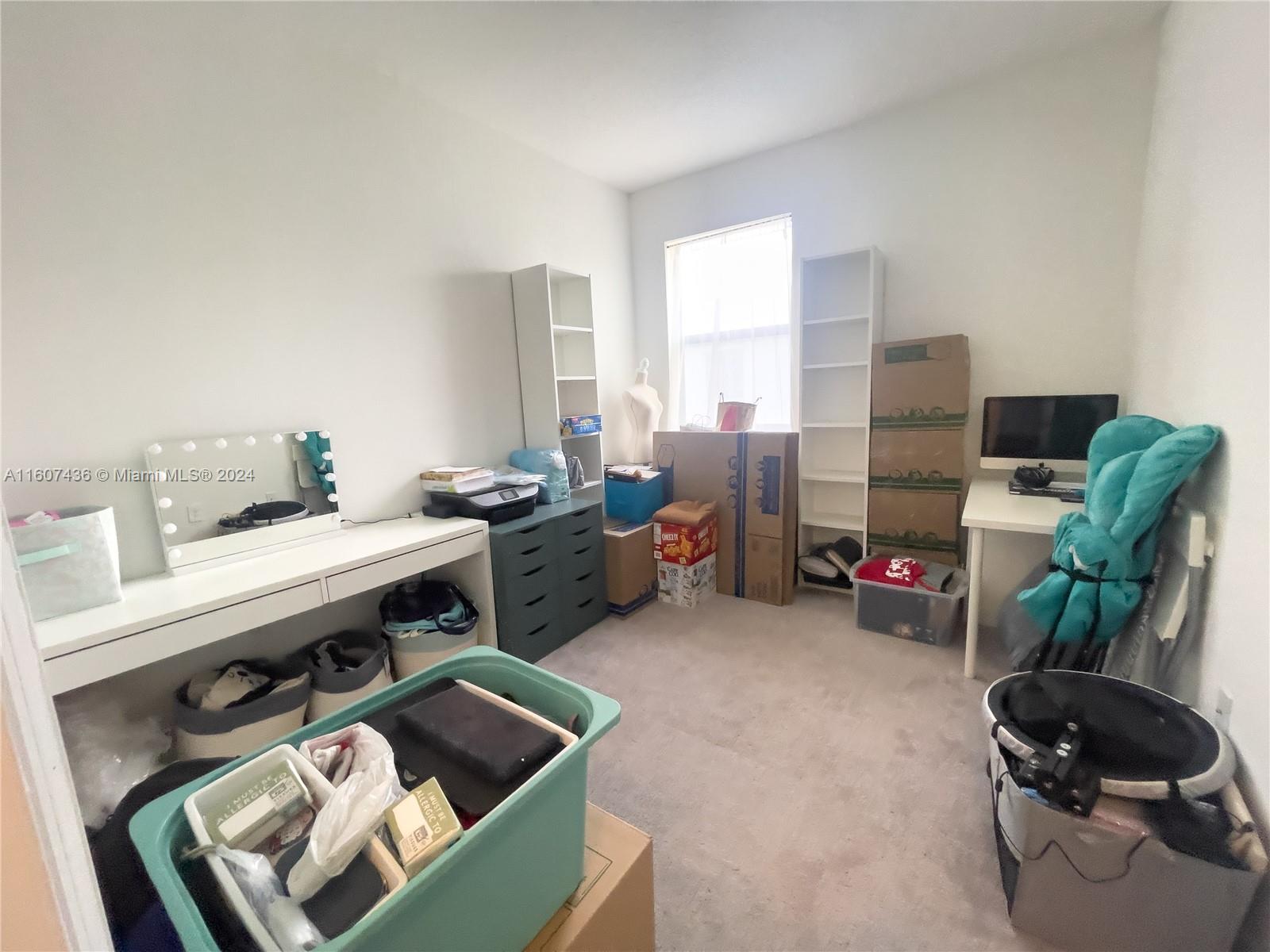 13414 Southwest 286th Street, Unit 13414 Homestead, FL 33033 - Photo 19 of 34 a room with furniture a rug and a potted plant