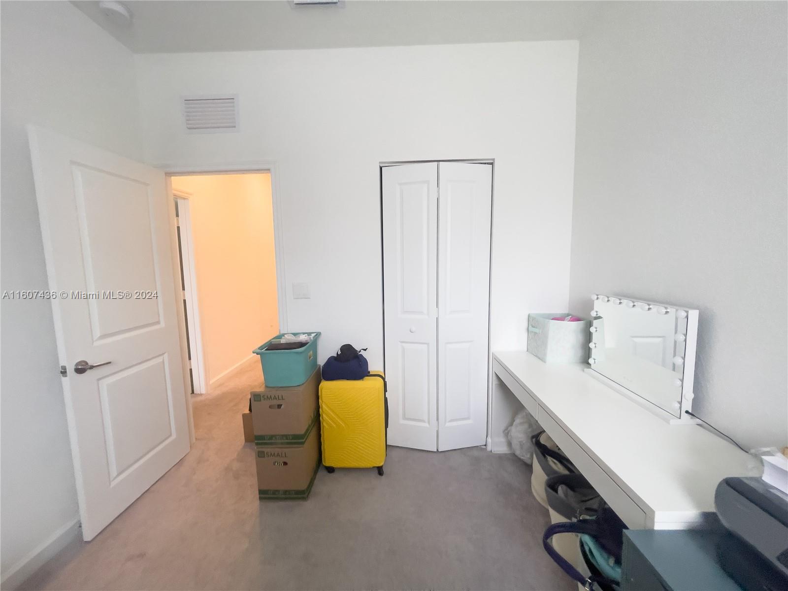 13414 Southwest 286th Street, Unit 13414 Homestead, FL 33033 - Photo 20 of 34 a room with a bed and workspace
