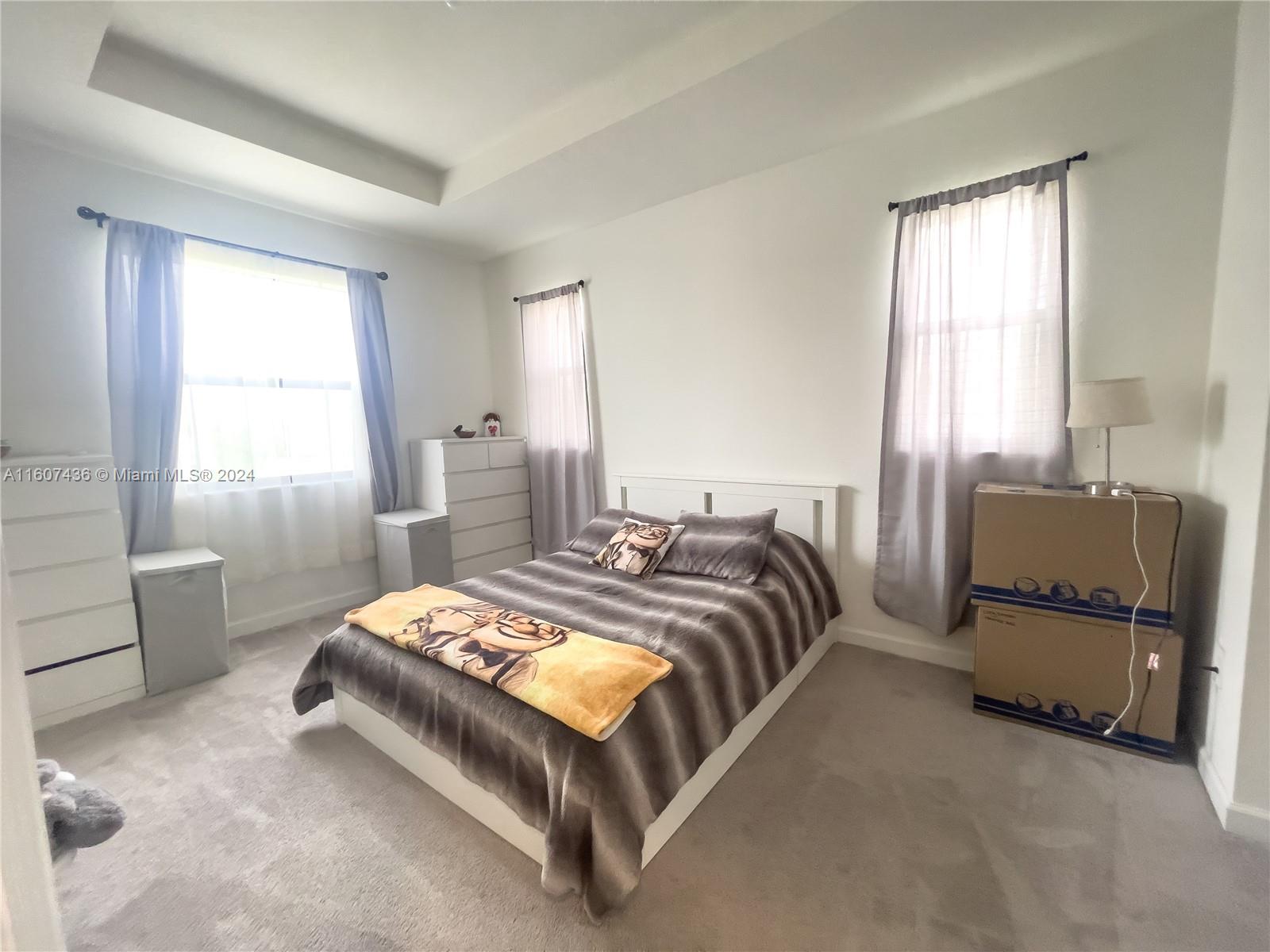 13414 Southwest 286th Street, Unit 13414 Homestead, FL 33033 - Photo 21 of 34 a bedroom with a bed and a window