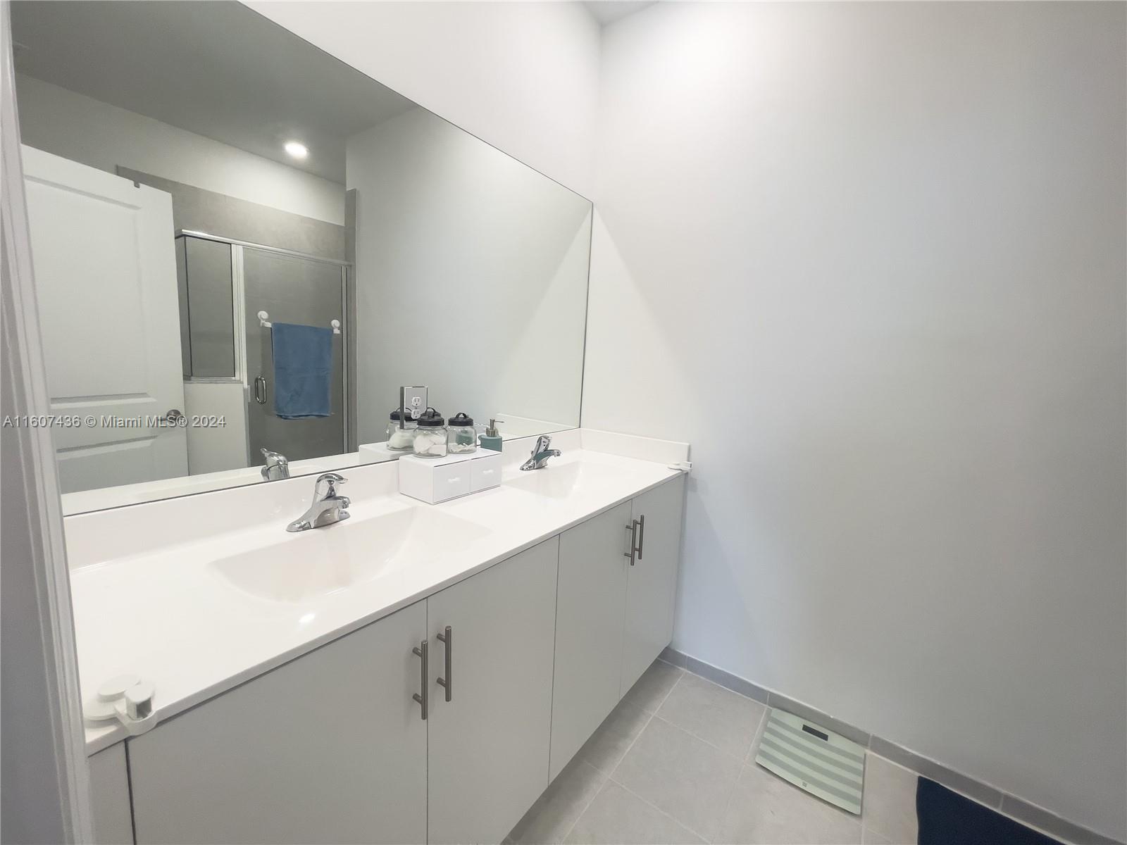 13414 Southwest 286th Street, Unit 13414 Homestead, FL 33033 - Photo 24 of 34 a bathroom with a sink and a mirror